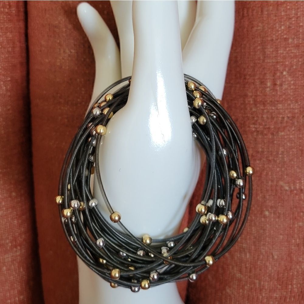 Set of 24 Spring Bracelets with gold and silver beads.